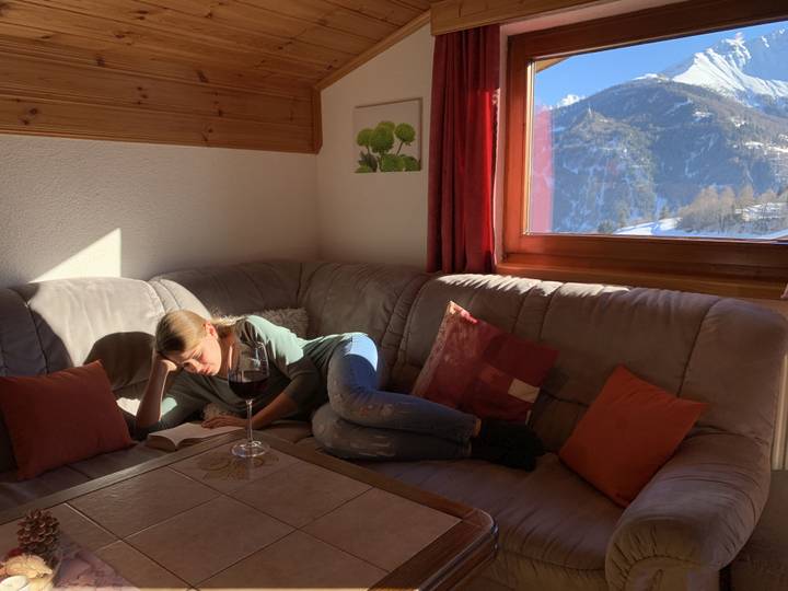 Seating area by the window with mountain views