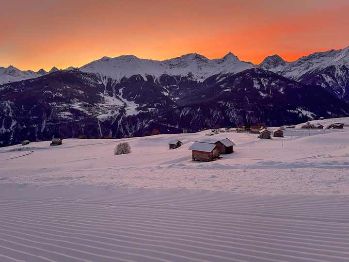 Freshly groomed piste in the evening glow